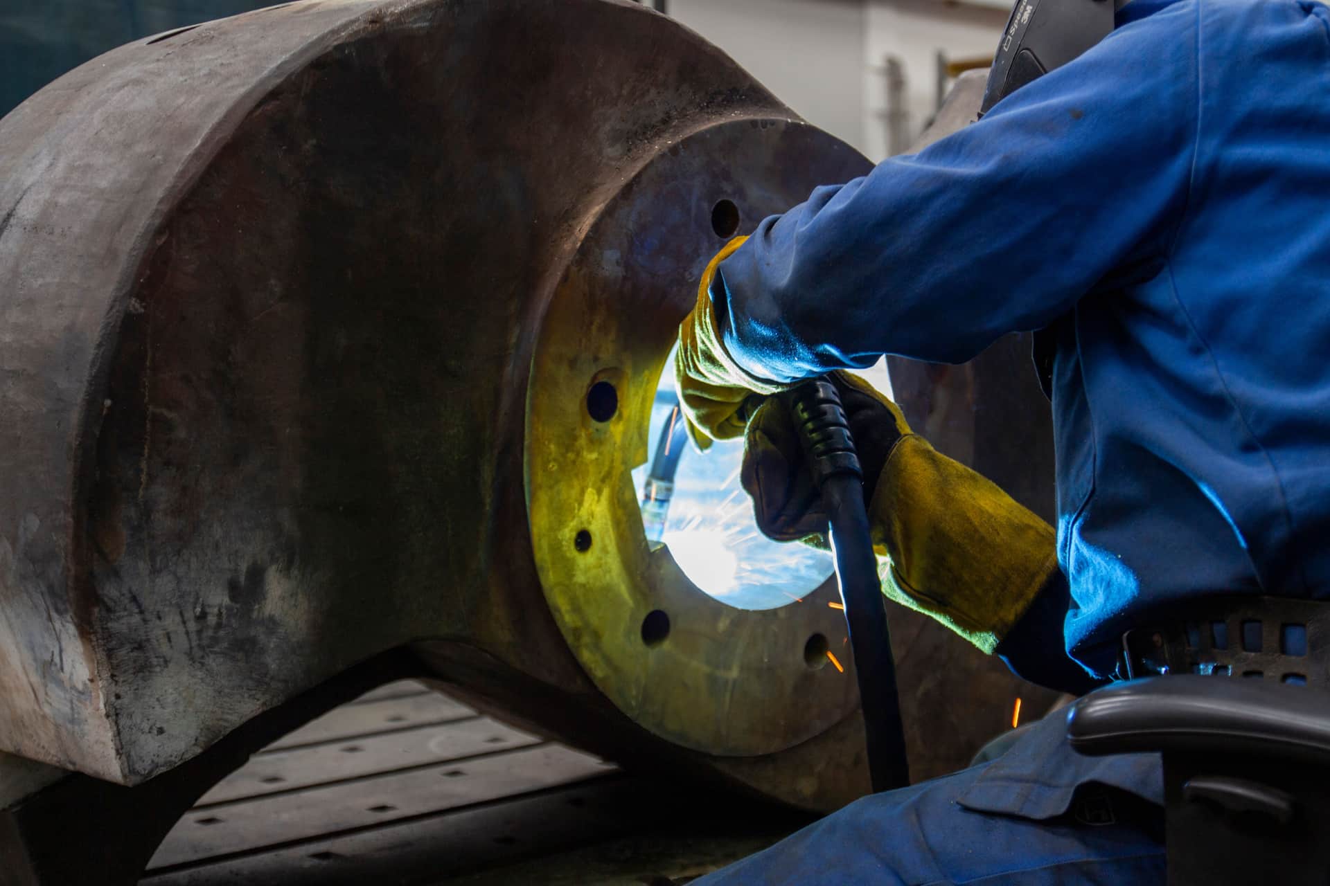 A compact multiprocess inverter welder with a digital display on a clean bench